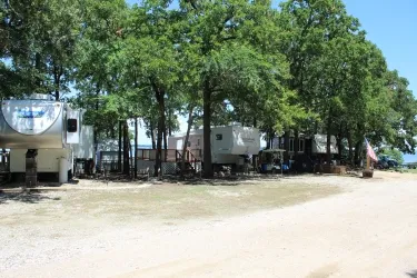 Shaded RV site near the lake